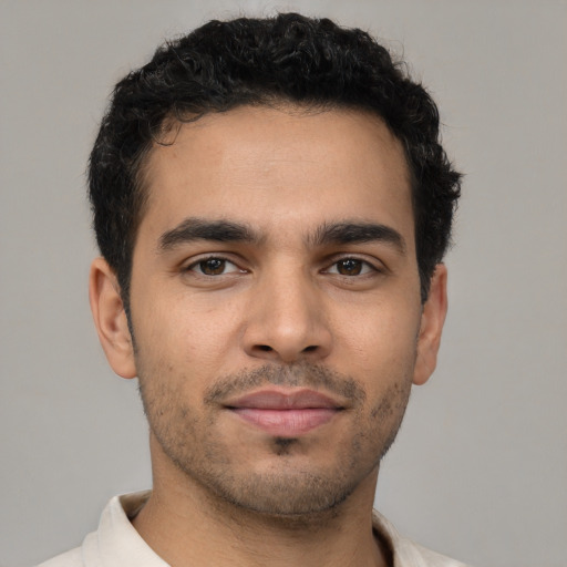 Neutral latino young-adult male with short  black hair and brown eyes