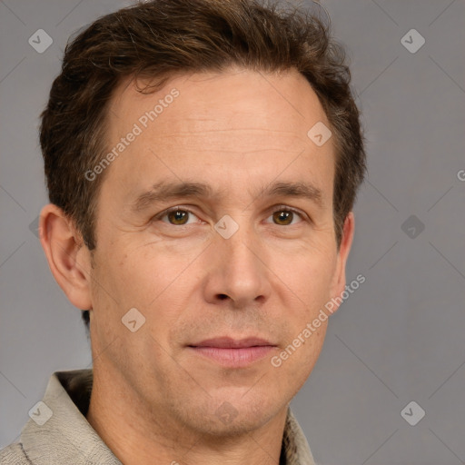 Joyful white adult male with short  brown hair and grey eyes