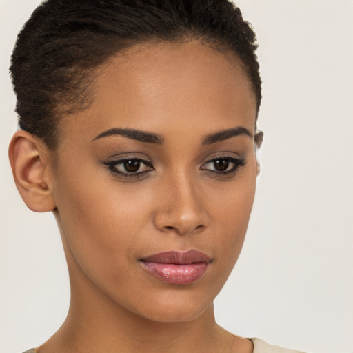 Joyful latino young-adult female with short  brown hair and brown eyes