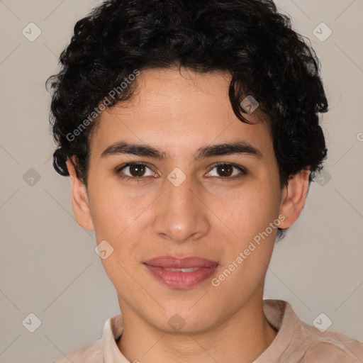 Joyful latino young-adult male with short  brown hair and brown eyes