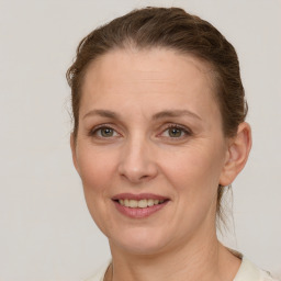 Joyful white adult female with short  brown hair and grey eyes