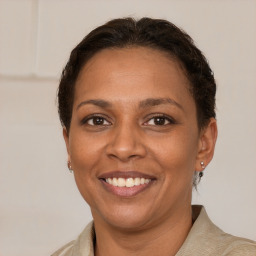 Joyful white adult female with short  brown hair and brown eyes