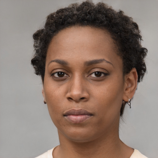 Neutral black young-adult female with short  brown hair and brown eyes