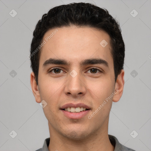 Joyful white young-adult male with short  black hair and brown eyes