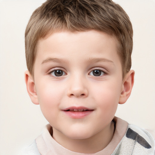 Joyful white child male with short  brown hair and brown eyes