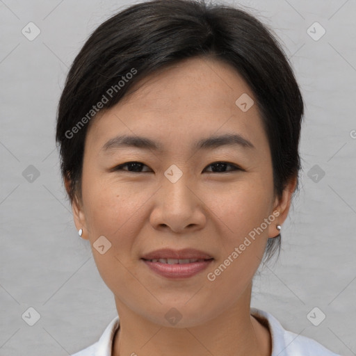 Joyful asian young-adult female with short  brown hair and brown eyes