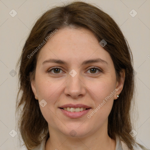 Joyful white young-adult female with medium  brown hair and grey eyes