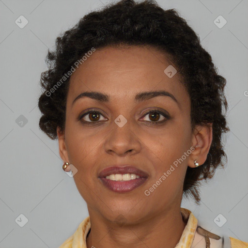 Joyful black young-adult female with short  brown hair and brown eyes