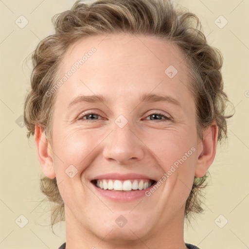 Joyful white young-adult female with medium  brown hair and blue eyes