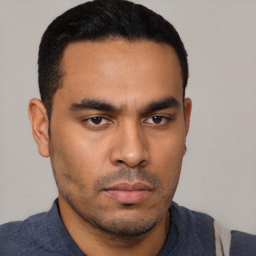 Neutral latino young-adult male with short  black hair and brown eyes