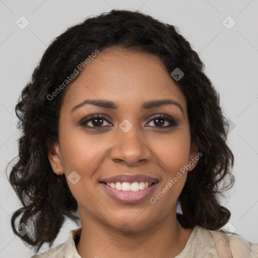 Joyful black young-adult female with medium  brown hair and brown eyes