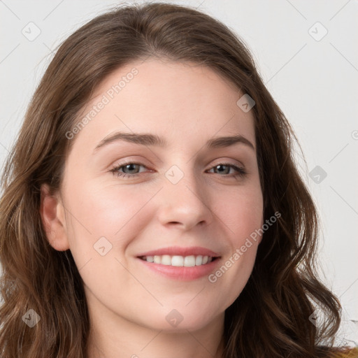 Joyful white young-adult female with long  brown hair and grey eyes