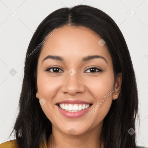 Joyful latino young-adult female with long  black hair and brown eyes