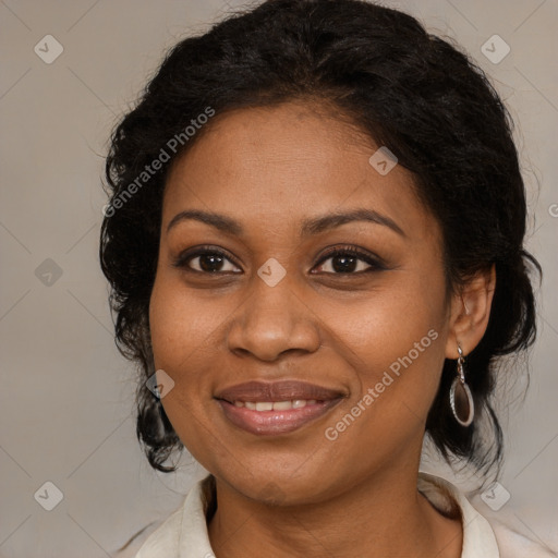 Joyful black adult female with medium  brown hair and brown eyes