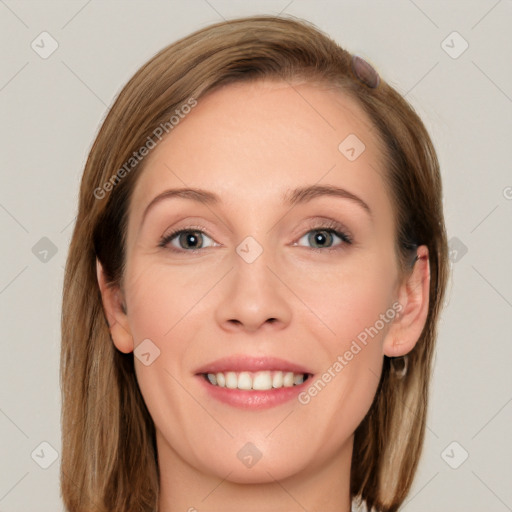 Joyful white young-adult female with long  brown hair and grey eyes