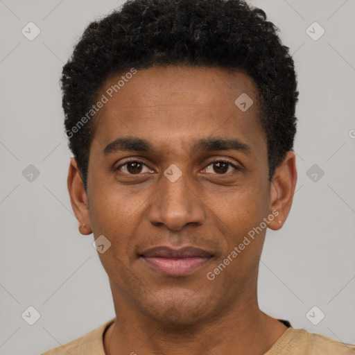 Joyful black young-adult male with short  black hair and brown eyes