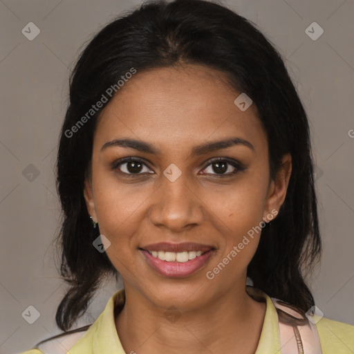 Joyful black young-adult female with medium  brown hair and brown eyes