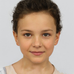 Joyful white child female with short  brown hair and brown eyes