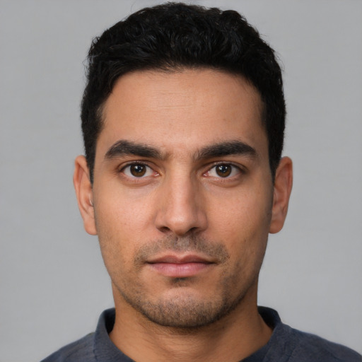 Neutral white young-adult male with short  black hair and brown eyes