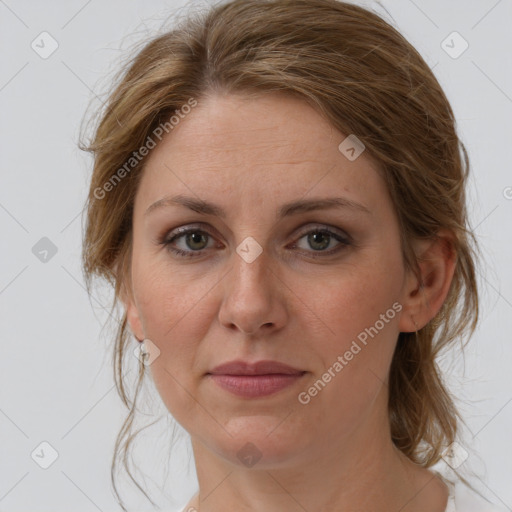 Joyful white adult female with medium  brown hair and grey eyes