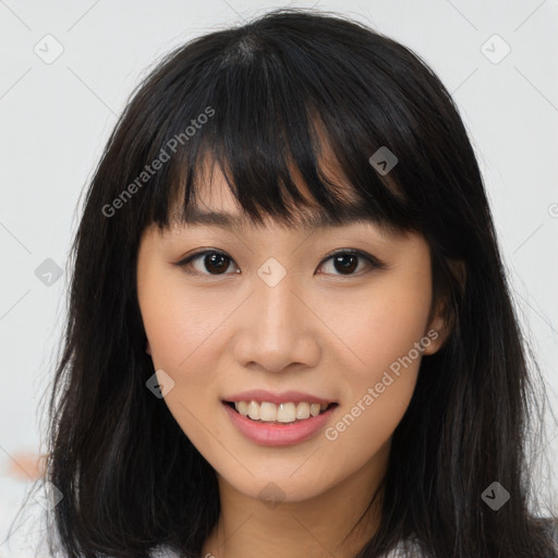 Joyful asian young-adult female with long  brown hair and brown eyes