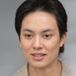 Joyful asian young-adult female with short  brown hair and brown eyes