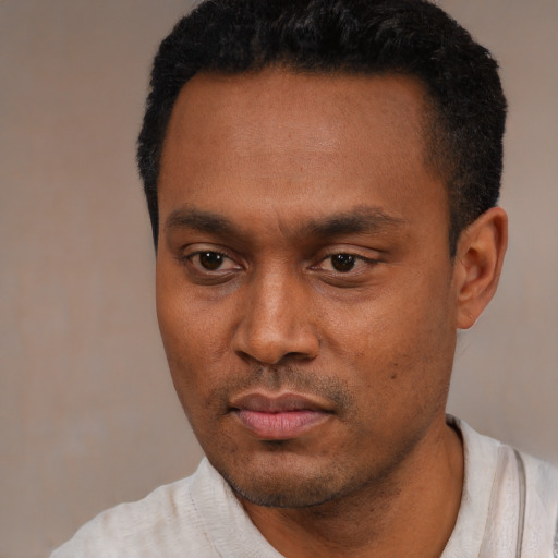 Neutral latino young-adult male with short  black hair and brown eyes
