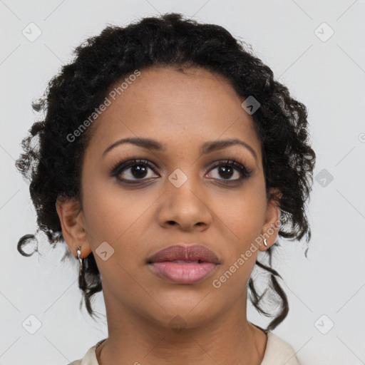 Joyful black young-adult female with medium  brown hair and brown eyes