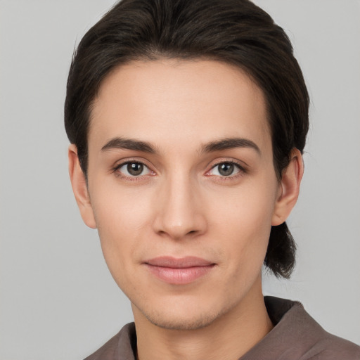 Joyful white young-adult female with short  brown hair and brown eyes