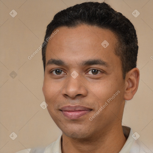 Joyful white young-adult male with short  black hair and brown eyes