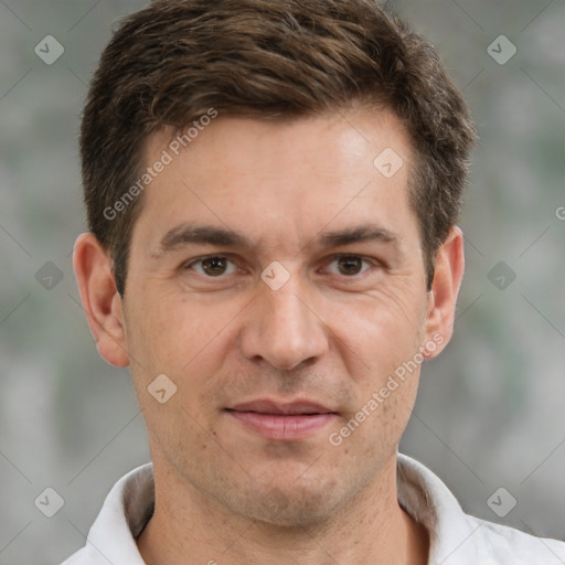 Joyful white adult male with short  brown hair and brown eyes