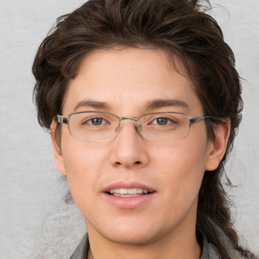 Joyful white adult male with medium  brown hair and brown eyes