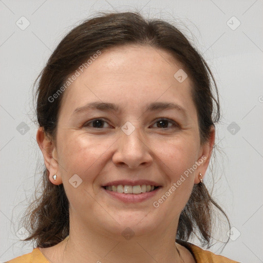 Joyful white adult female with medium  brown hair and grey eyes