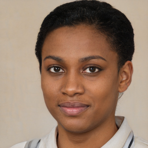 Joyful latino young-adult female with short  black hair and brown eyes