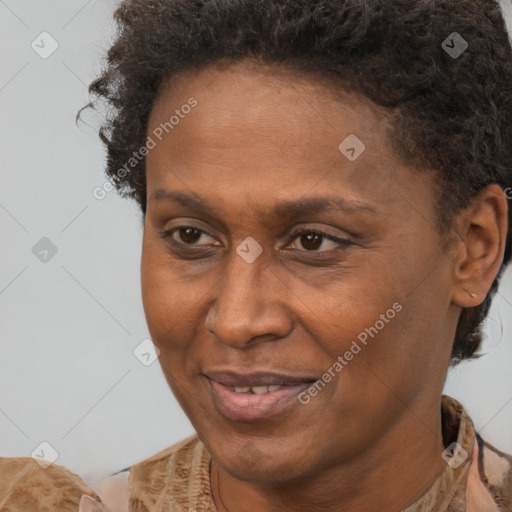 Joyful black adult female with short  brown hair and brown eyes