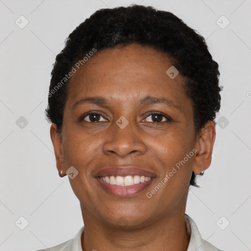 Joyful black adult female with short  brown hair and brown eyes