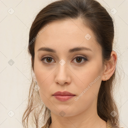 Neutral white young-adult female with long  brown hair and brown eyes