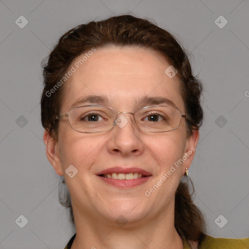 Joyful white adult female with medium  brown hair and blue eyes