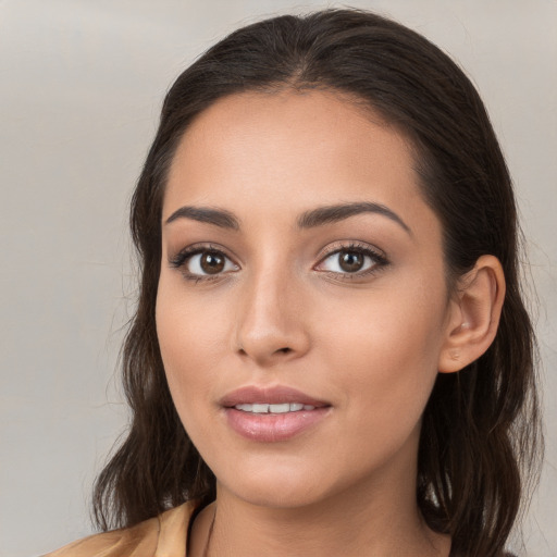 Neutral white young-adult female with long  brown hair and brown eyes