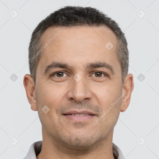 Joyful white adult male with short  brown hair and brown eyes