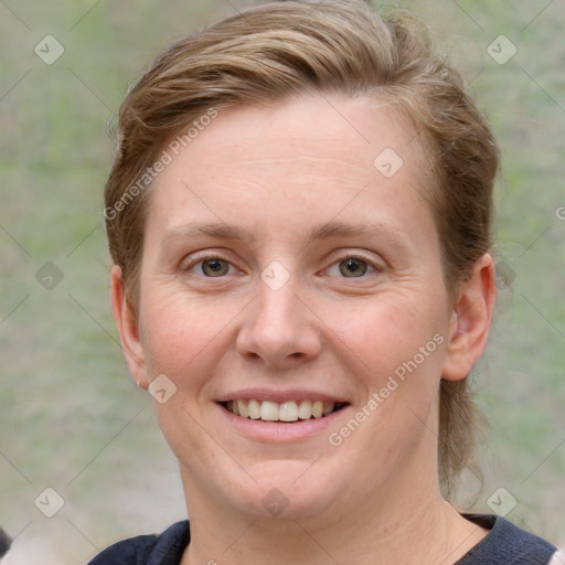 Joyful white young-adult female with medium  brown hair and blue eyes