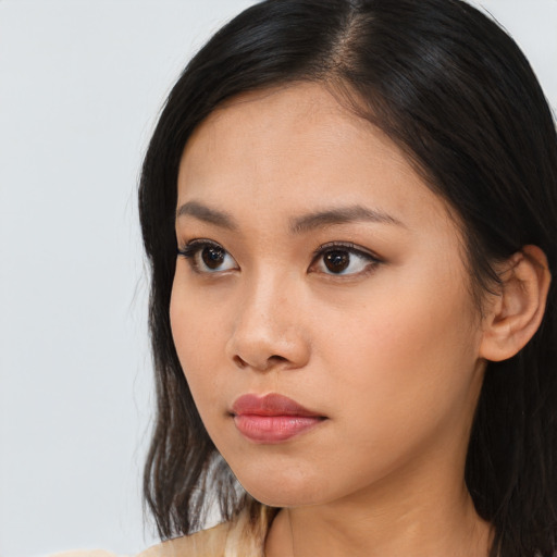 Neutral asian young-adult female with long  brown hair and brown eyes