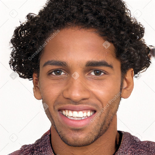 Joyful black young-adult male with short  brown hair and brown eyes