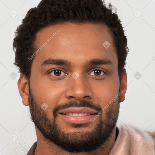 Joyful black young-adult male with short  brown hair and brown eyes