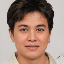 Joyful asian young-adult male with short  brown hair and brown eyes