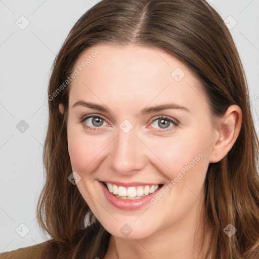 Joyful white young-adult female with long  brown hair and blue eyes