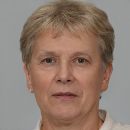 Joyful white middle-aged female with short  brown hair and brown eyes