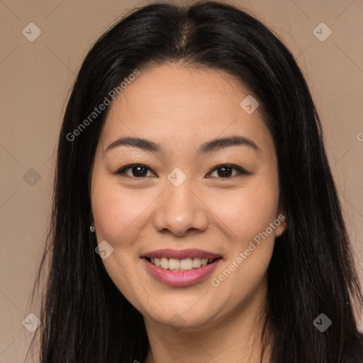 Joyful asian young-adult female with long  brown hair and brown eyes