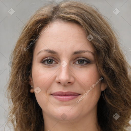 Joyful white adult female with long  brown hair and brown eyes