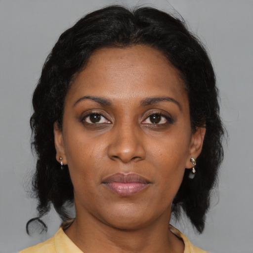Neutral black adult female with medium  brown hair and brown eyes